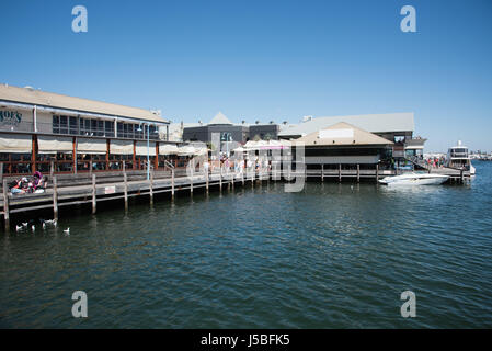 Fremantle,WA,Australia-November 13,2016: Waterfront restaurants with boardwalk and nautical vessels in Fremantle, Western Australia Stock Photo