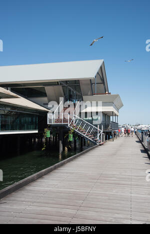 Fremantle,WA,Australia-November 13,2016: Tourists on the boardwalk by waterfront restaurants in the Boat Harbour in Fremantle, Western Australia. Stock Photo