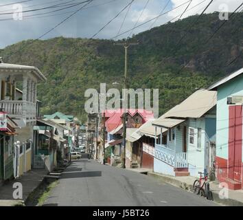 Street in Soufrière, St. Lucia The narrow streets bordered by old houses is one attraction that draws visitors to Soufrière, St. Lucia. Stock Photo