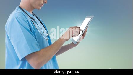 Digital composite of Doctor mid section touching tablet against blue green background Stock Photo