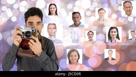 Digital composite of Confident photographer holding camera against flying business portraits Stock Photo