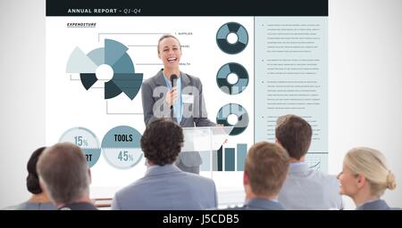 Digital composite of Happy businesswoman giving presentation with graphs in background Stock Photo