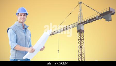 Digital composite of Smiling architect holding blueprint against crane Stock Photo