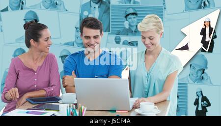 Digital composite of Hipsters using laptop at desk against graph Stock Photo