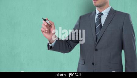 Digital composite of Midsection of businessman writing on imaginary screen Stock Photo