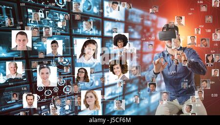 Digital composite of Man looking at flying portraits on VR glasses Stock Photo