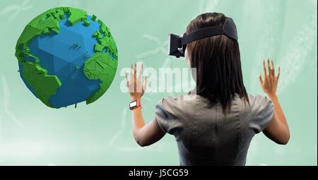 Digital composite of Rear view of businesswoman looking at low poly earth on VR glasses Stock Photo