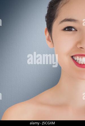 Digital composite of Close up of half woman's face against navy background Stock Photo