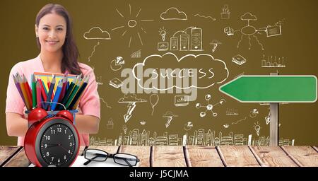 Digital composite of Female student with color pencils at desk against success graphics Stock Photo