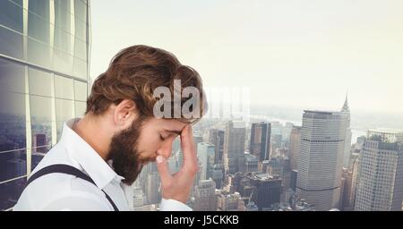 Digital composite of Tensed hipster touching forehead against cityscape Stock Photo