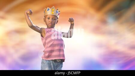 Digital composite of Portrait of kid wearing crown while flexing muscles Stock Photo