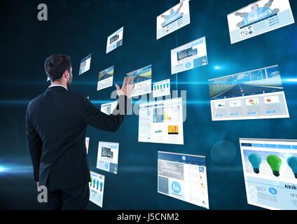 Digital composite of panels with websites(blue) dark blue background. business man doing thing on these Stock Photo