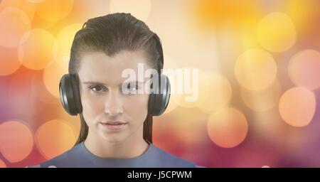 Digital composite of Female hipster listening to music against bokeh Stock Photo
