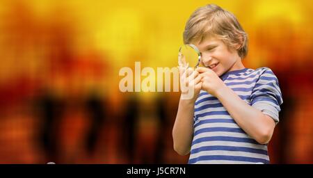 Digital composite of Curious boy looking through magnifying glass over bokeh Stock Photo