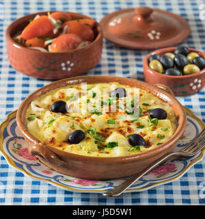 Bacalhau com natas. Portuguese salt cod with potatoes and cream. Portugal Food Stock Photo