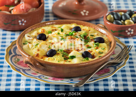 Bacalhau com natas. Portuguese salt cod with potatoes and cream. Portugal Food Stock Photo