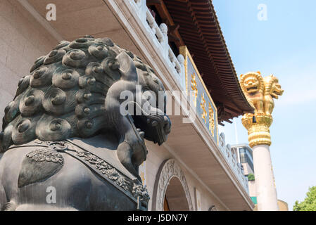 Lion guardian statue at Jing'An Buddhist temple in Shanghai, China Stock Photo