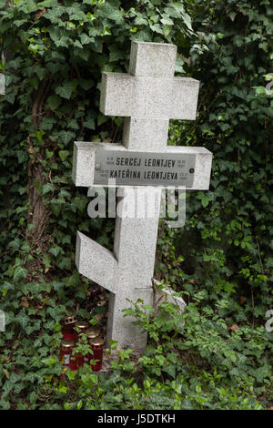 Grave of Russian boy Sergej Leontjev on the burial ground for the orthodox people at Olšany Cemetery in Prague, Czech Republic. Sergey Leontiev (also spelled Sergei Leontieff), born on 5 August 1908 and died on 19 October 1921 at age 13 as a schoolboy, was the oldest son of Russian general Maxim Leontieff (1871 - 1948). His family was one of the thousands and thousands Russian families forced to leave their homeland after the Bolshevik Revolution. Kateřina Leontjeva, who was born on 29 October 1912 and died on 22 March 1985 at age 72 was probably a daughter of general Maxim Leontieff. Stock Photo