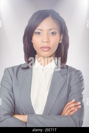 Digital composite of Close up of business woman arms folded against white background Stock Photo