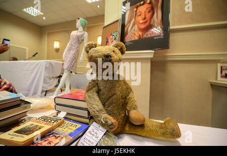 A sale of items, including the curlers, pinny and a headscarf worn by Coronation Street actress Jean Alexander, who played the soap's battleaxe Hilda Ogden, at the Royal Clifton Hotel, in Southport. Stock Photo