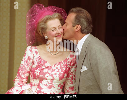 The Count Jean-Francois De Chambrun kisses his wife the Dowager Countess Raine Spencer at Lucknam Park Hotel following the blessing of their marriage at Holy Trinity Church in Cold Ashton, near Bath. Stock Photo