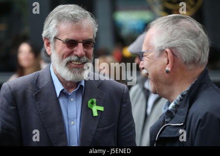 Sinn Fein's Gerry Adams (left) speaks to artist Robert Ballagh before a memorial ceremony in Dublin's Talbot Street marking the anniversary of the bombings in Dublin and Monaghan on May 17 1974. Stock Photo