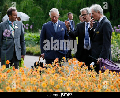 The Prince of Wales (centre) views a display planted in the Great Broad Walk Borders during a visit to the Royal Botanic Gardens, at Kew, Richmond, Surrey. Stock Photo