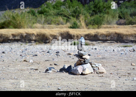 A cairn built by tourists in a portion of the dry riverbed at the Rio Grande at Santa Elena Canyon in Big Bend National Park. Stock Photo