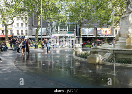 Tourists around the fountain in London's Leicester Square Stock Photo