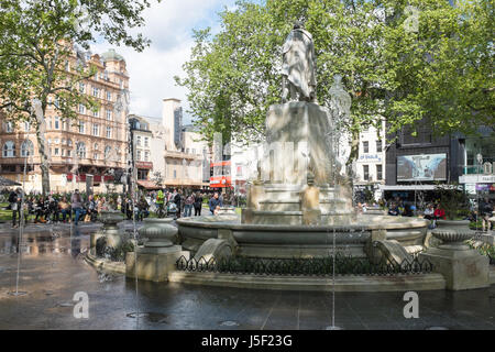 Tourists around the fountain in London's Leicester Square Stock Photo