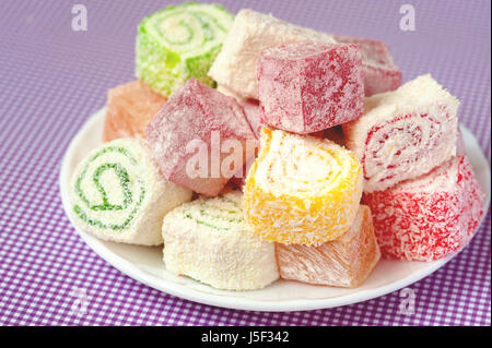 Set of assorted traditional eastern desserts. Arabian sweets on a metal dish. rahat lokum in a colorful plates. Selective focus Stock Photo
