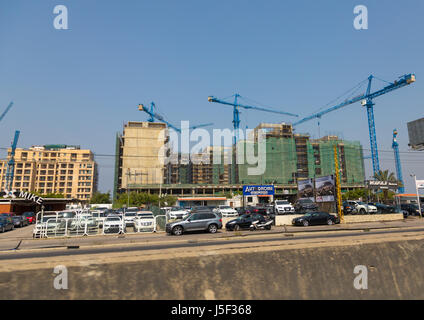 Cars shop in front of buildings under construction, Beirut Governorate, Beirut, Lebanon Stock Photo