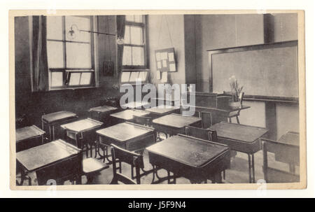 Original early 1900s postcard of empty Victorian classroom and row of desks in Class 4a, at County Grammar School for Girls, Market Drayton, Shropshire, U.K. circa 1910 Stock Photo
