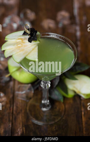 Apple Martini in glasses on wooden background. Stock Photo