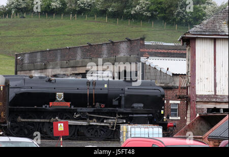 Southern Region Merchant Navy class steam locomotive British India Line, carrying the nameplate Bodmin  returns on shed at Carnforth, Lancashire. Stock Photo