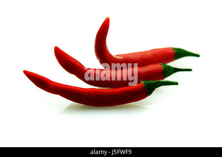 isolated three chilies Stock Photo