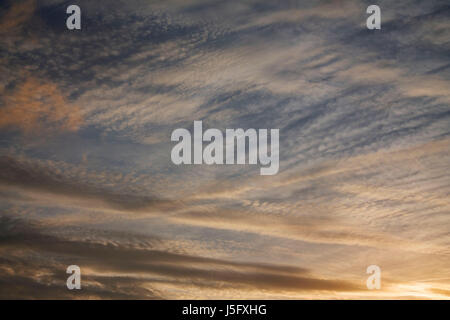 The patterns created by the clouds in the sky, taken during golden hour, thus producing beautiful rich colours. Stock Photo