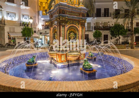 The main square in Vejer de la Frontera, featuring a beautiful fountain with colorful ceramic tiles, Cadiz, Spain Stock Photo