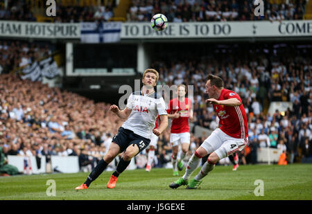 Eric Dier of Tottenham Hotspur lofts the ball over Phil Jones of Manchester United during the Premier League match between Tottenham Hotspur and Manchester United at White Hart Lane in London. 14 May 2017 EDITORIAL USE ONLY . No merchandising. For Football images FA and Premier League restrictions apply inc. no internet/mobile usage without FAPL license - for details contact Football Dataco ARRON GENT/TELEPHOTO IMAGES Stock Photo