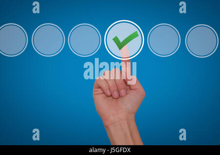 Young male hand touching, pressing modern button and ticking check box out of empty boxes on digital screen interface. Isolated on blue. Business tech Stock Photo