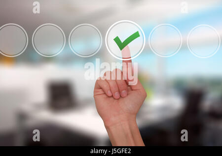 Young male hand touching, pressing modern button and ticking check box out of empty boxes on digital screen interface. Isolated on office. Business te Stock Photo