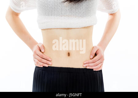 Teenage girl with hands on sides, closeup Stock Photo