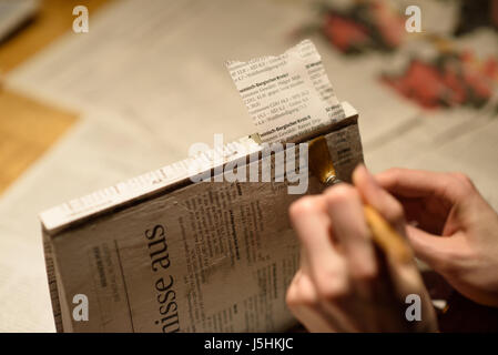 Girl painting or plastering a book Stock Photo