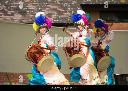 London, UK - August 15, 2009: Korean ethnic dancers perform, Jangguchum, dance with janggu, hourglass-shaped drum, in the Korean Festival on August 15 Stock Photo