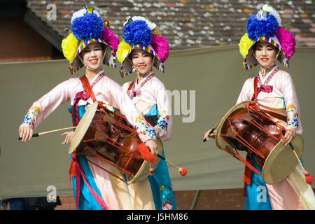 London, UK - August 15, 2009: Korean ethnic dancers perform, Jangguchum, dance with janggu, hourglass-shaped drum, in the Korean Festival on August 15 Stock Photo