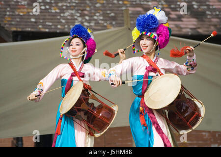 London, UK - August 15, 2009: Korean ethnic dancers perform, Jangguchum, dance with janggu, hourglass-shaped drum, in the Korean Festival on August 15 Stock Photo