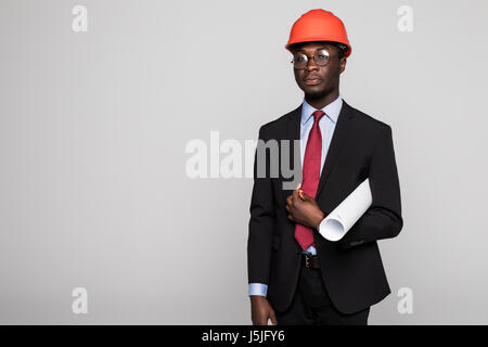 Young Afro-American engineer with blueprints isolated on white Stock Photo