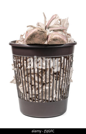 Old ragged baby pink sneakers in a trash can isolated on a white background Stock Photo