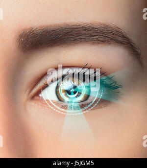 The conceptual image of digital eye of a young woman Stock Photo