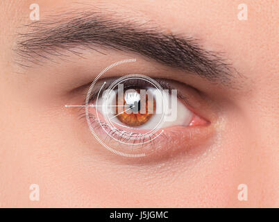 The conceptual image of digital eye of a young man Stock Photo